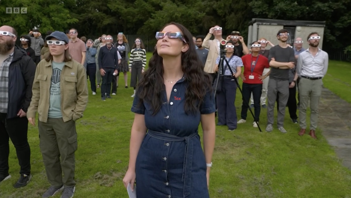 Everyone with eclipse glasses hoping to see something.